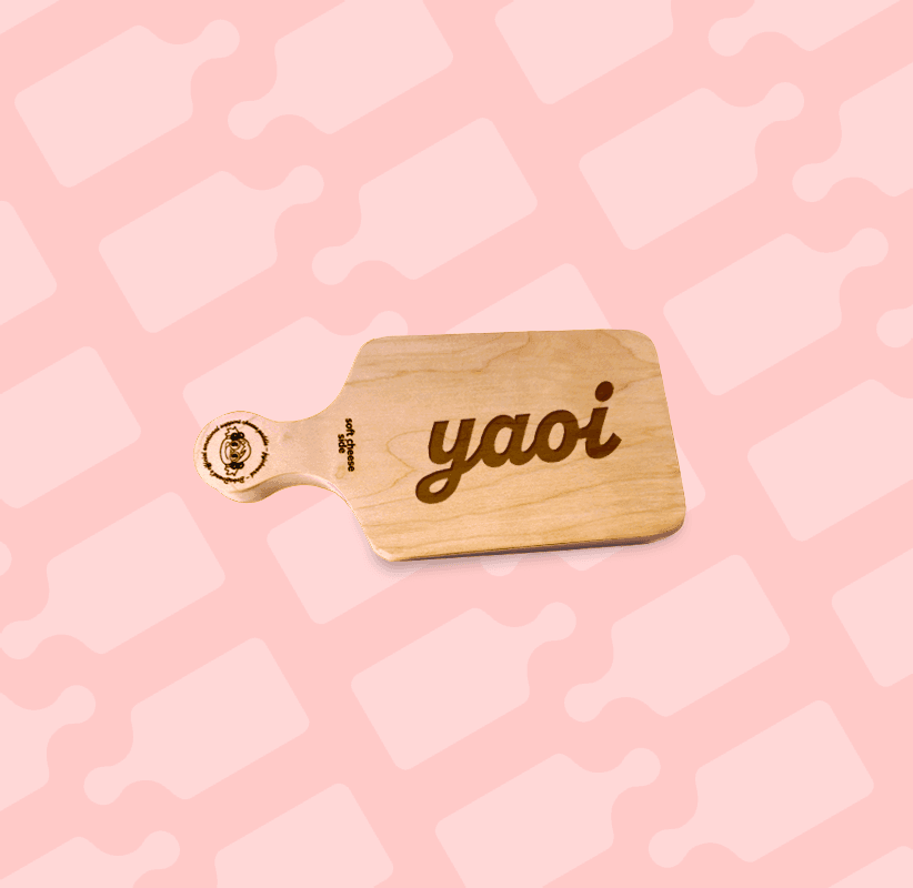 Smaller Chibi size cheeseboard with yaoi laser engraved on the main surface. Boba-tan's face is the handle decoration.